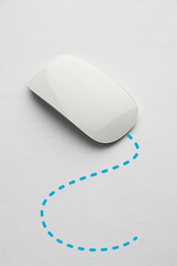 modern white mouse with blue line of travel