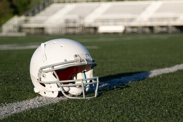 white blank helmet, american football helmet on grass