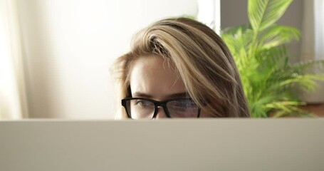 Wall Mural - young woman with glasses rubbing eyes