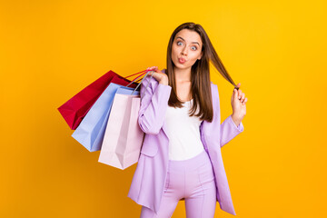 Sticker - Portrait of her she nice-looking pretty attractive lovely charming cheerful cheery funky childish girl carrying bags grimacing pout lips isolated on bright vivid shine vibrant yellow color background