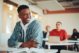 Fototapeta  - Smiling male student sitting in university classroom