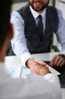 © H_Ko - Man in suit and tie give hand as hello in office closeup. Friend welcome mediation offer positive introduction thanks gesture summit executive approval motivation male arm strike bargain