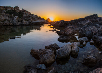 Wall Mural - Colours of Slug's Bay at Dawn as the sea reflects the sky 