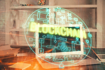 multi exposure of blockchain theme hologram and table with computer background. concept of bitcoin c