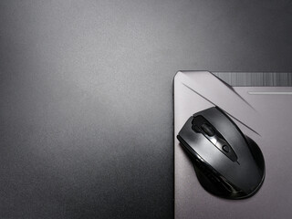 black modern computer mouse on dark background