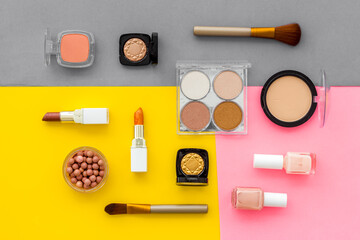 Set of decorative makeup cosmetics on colorful background, top view