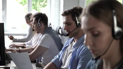 Canvas Print - Service phone operators sit at shared desk focus on sales. Agent woman in headset use pc answers incoming calls talk with client provide professional support to customers sell company product concept