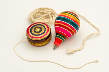 Sticker - Colorful yo-yo and trompo on a white background