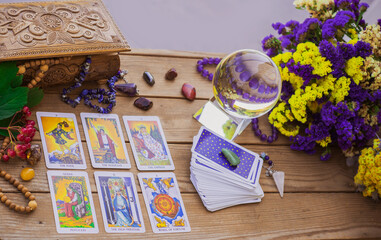 Tarot card on a table, White magic, attributes for witch,  magic for love, health, attracting happiness . Esoteric concept