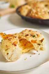 Sticker - Freshly-made delicious cheese bubble pizza bread with ingredients and cheese on a white table