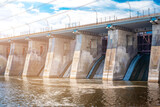 Fototapeta Zwierzęta - Togliatti? Russia - 19 July 2020. The dam of the Volga hydroelectric power station without water discharge. Electricity, road.