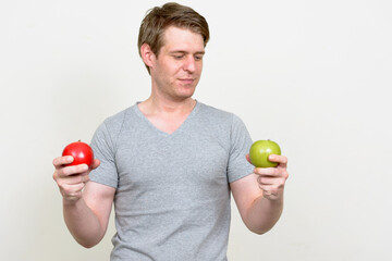 Portrait of young handsome man ready for gym