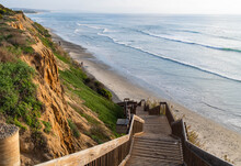 Beautiful Sunset Background Of Wooden Steps Leading Down To The Ocean During A Calm, Warm Day In Cardiff By The Sea, California, North Of San Diego On The Pacific Coast