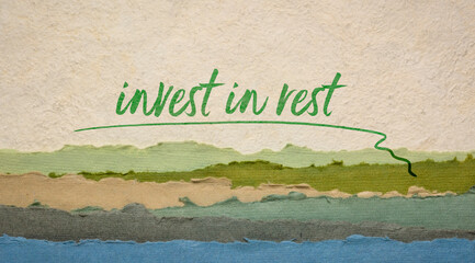 Wall Mural - Invest in rest reminder or advice - handwriting on a handmade paper with abstract landscape, healthy lifestyle concept