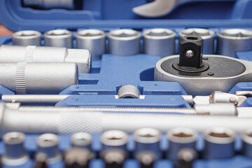 Close-up wrenches in a tool case. Chrome plated wrenches. Wrenches of different sizes and types.