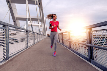 Wall Mural - Woman exercising outdoors.