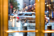 Grand Central Terminal Entrance, Traffic Cars, From Lexington Avenue In New York City NYC, Rainy Day Or Evening, Looking Outside Through Door Window Blurred Abstract Background Bokeh