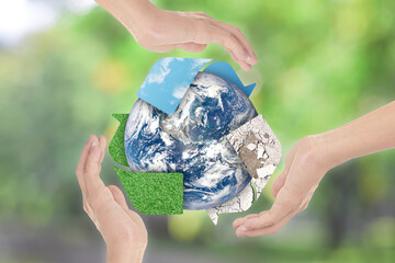 Canvas Print - recycle symbol and earth in hands over green nature background. environment concept. elements of thi