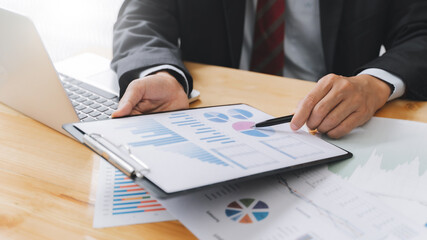 Wall Mural - Financial inspector calculating a numbers in office room.