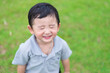 © pookpiik - Little Asian kid at the playground under the sunlight, shallow DOF