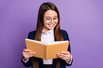 Poster - Close-up portrait of her she lovely focused brainy long-haired pre-teen girl schoolchild reading home task homework diary isolated bright vivid shine vibrant lilac violet color background