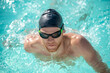 Close up face of swimming swimmer in water