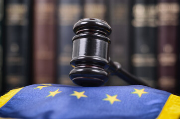 Wall Mural - Law library, Judge Gavel and United States of America flag on a black wooden background.