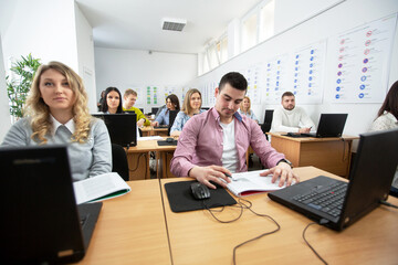 Students sitting at their desks listening close