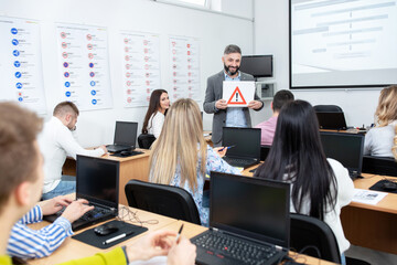 Wall Mural - Driving instructor asking students about the traffic sign