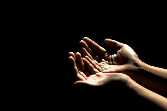 A man his praying hand for God's blessing To ask for your help In a state of depression from the kovid-19, he was affected both physically and mentally,and hope that everything would be well soon.