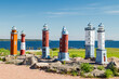 Kotka, Finland - 11 June 2020: Miniature scale models of finnish lighthouses on the waterfront in the Katariina Seaside Park.