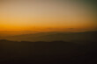 © Pornthep - View of silhouatte of mountain range under the sky during the sunset. Beautiful evening nature background.