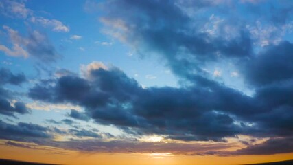 Wall Mural - time lapse video of evening blue clouds on a sunset sky.