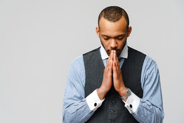 African american man holding hands in prayer hoping for better