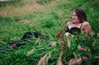 © Denis - Beautiful girl in black bra and long skirt lies in the grass
