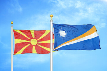 North Macedonia and Marshall Islands two flags on flagpoles and blue sky