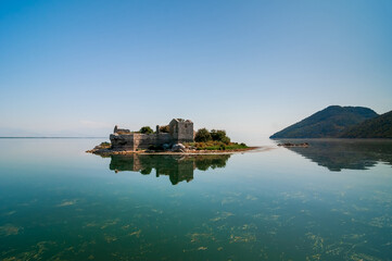 Montenegro landscape. In the center of Skadar Lake are the ruins of a fortress - Grmozur Prison. The ruins are about two hundred years old.