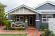 © Caro Telfer/Austockphoto - Exterior of renovated suburban home
