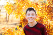 © Clare Seibel-Barnes/Austockphoto - Portrait of a happy ten year old in autumn