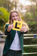 © Gillian Vann/Austockphoto - learner driver holding L plate