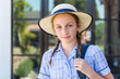 © Gillian Vann/Austockphoto - high school student with hat and backpack