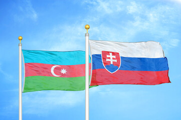 Azerbaijan and Slovakia two flags on flagpoles and blue sky