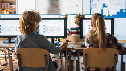Elementary School Science Classroom: Smart Little Schoolchildren who Work on Personal Computers Learn Programming Language for Software Coding. Schoolchildren Getting Modern Education