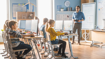 Wall Mural - elementary school science classroom: teacher educates smart little schoolchildren who work on person
