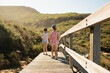 © Kathryn Jewkes/Austockphoto - Two girls walking along a boardwalk