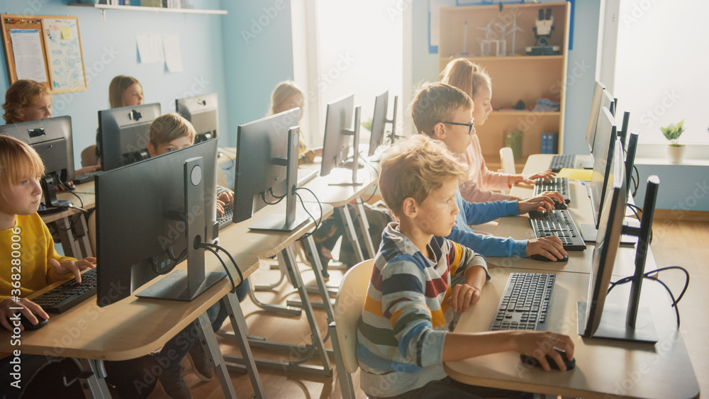 Computer Science Tools Elementary Elementary School Computer Science Classroom: Diverse Group of Little ...