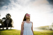 © Robert Lang/Austockphoto - Young girl looking up at the cloudy sky