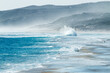© Rosalie Dibben/Austockphoto - seahaze and waves crashing into shore