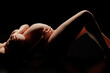 © PixlMakr - Pregnant woman laying on her back