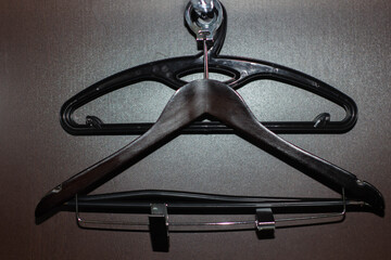 two hangers in the closet in the hotel